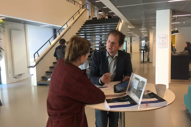 Study advisor talking to student.